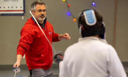 Coach presenting to student